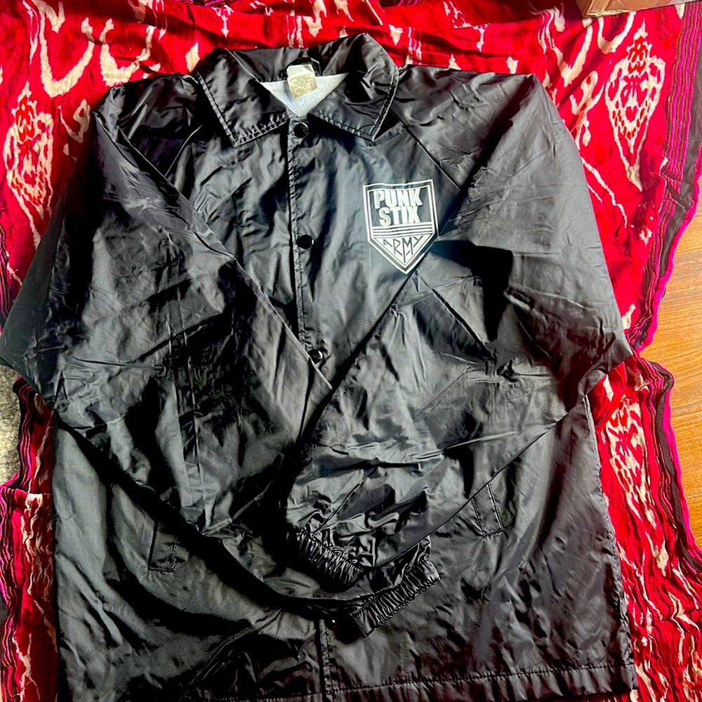 New with no tags . Adult small windbreaker
